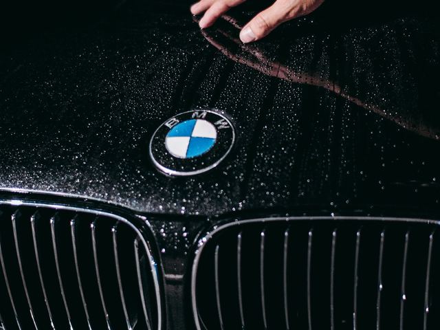 Water beading across a freshly protected hood